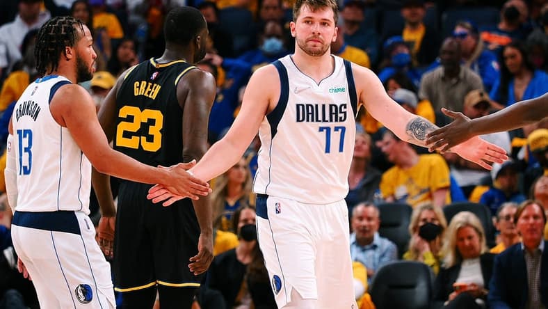 May 26, 2022; San Francisco, California, USA; Dallas Mavericks guard Luka Doncic (77) high fives guard Jalen Brunson (13) after a play against the Golden State Warriors during the second half of game five of the 2022 western conference finals at Chase Center. Mandatory Credit: Kelley L Cox-USA TODAY Sports