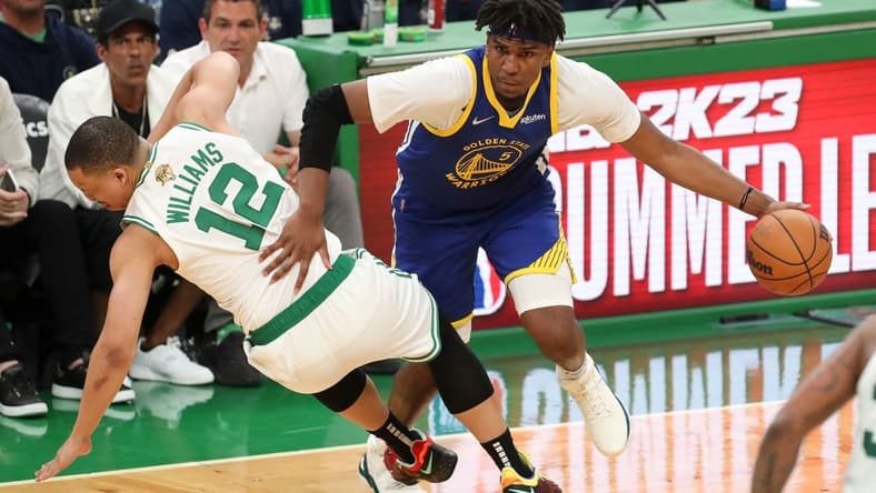 Jun 16, 2022; Boston, Massachusetts, USA; Golden State Warriors center Kevon Looney (5) drives to the basket against Boston Celtics forward Grant Williams (12) during the third quarter of game six in the 2022 NBA Finals at the TD Garden. Mandatory Credit: Paul Rutherford-USA TODAY Sports