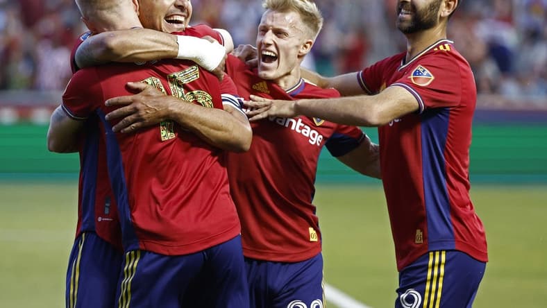 Jun 18, 2022; Sandy, Utah, USA; Real Salt Lake defender Marcelo Silva (30) celebrates after his first half goal w9th defender Justen Glad (15), defender Jasper Loffelsend (28) and forward Justin Meram (9) against the San Jose Earthquakes at Rio Tinto Stadium. Mandatory Credit: Jeffrey Swinger-USA TODAY Sports