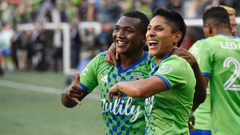 Jun 14, 2022; Seattle, Washington, USA; Seattle Sounders forward Raul Ruidiaz (right) celebrates his goal against the Vancouver Whitecaps with midfielder Jimmy Medranda (94) during the first half at Lumen Field. Mandatory Credit: Michael Thomas Shroyer-USA TODAY Sports