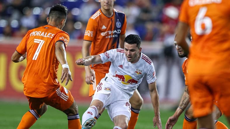 Jun 22, 2022; Harrison, NJ, United States; New York Red Bulls midfielder Lewis Morgan (10) plays the ball asNew York City FC midfielder Alfredo Morales (7) defends during the first half at Red Bull Arena. Mandatory Credit: Vincent Carchietta-USA TODAY Sports