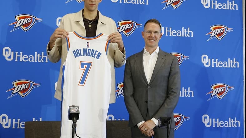 Jun 25, 2022; Oklahoma City, OK, USA; Oklahoma City Thunder forward Chet Holmgren poses with his jersey and general manager Sam Presti following an introductory press conference at Clara Luper Center. Mandatory Credit: Alonzo Adams-USA TODAY Sports