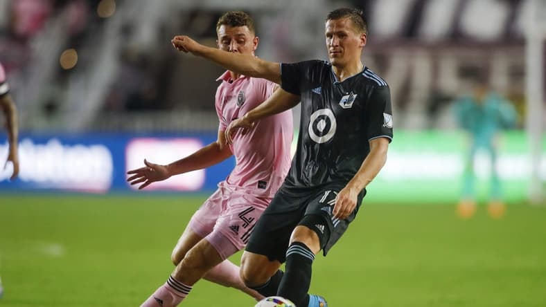 Jun 25, 2022; Fort Lauderdale, Florida, USA; Minnesota United midfielder Robin Lod (17) passes the ball against Inter Miami CF defender Christopher McVey (4) during the first half at DRV PNK Stadium. Mandatory Credit: Sam Navarro-USA TODAY Sports