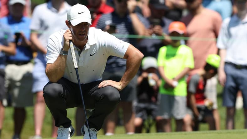 Jun 26, 2022; Cromwell, Connecticut, USA; Rory McIlroy looks over a putt on the fourth green during the final round of the Travelers Championship golf tournament. Mandatory Credit: Vincent Carchietta-USA TODAY Sports