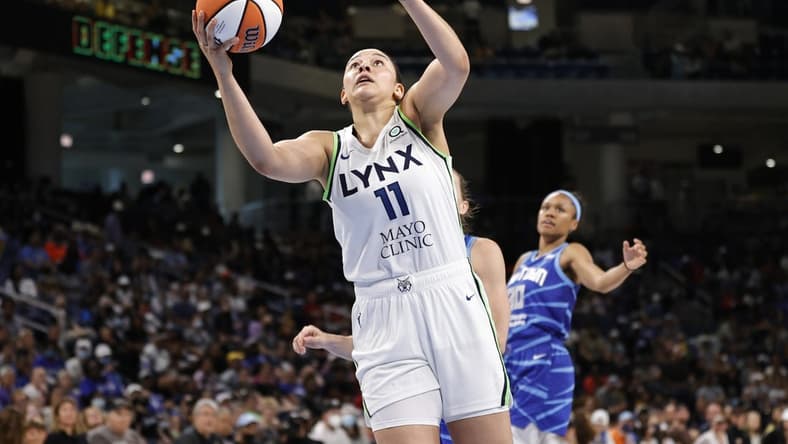 Jun 26, 2022; Chicago, Illinois, USA; Minnesota Lynx forward Natalie Achonwa (11) goes to the basket against the Chicago Sky during the second half of a WNBA game at Wintrust Arena. Mandatory Credit: Kamil Krzaczynski-USA TODAY Sports