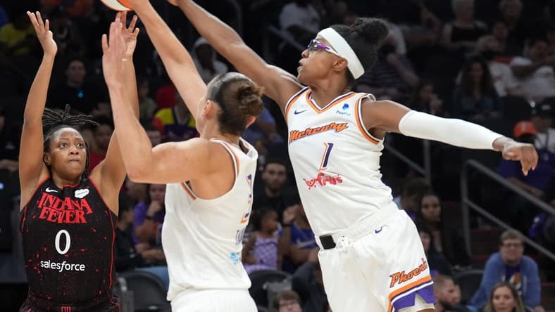 Jun 29, 2022; Phoenix, Arizona, USA; Phoenix Mercury guard Diamond DeShields (1) blocks a shot by Indiana Fever guard Kelsey Mitchell (0) during the second half at Footprint Center. Mandatory Credit: Joe Camporeale-USA TODAY Sports