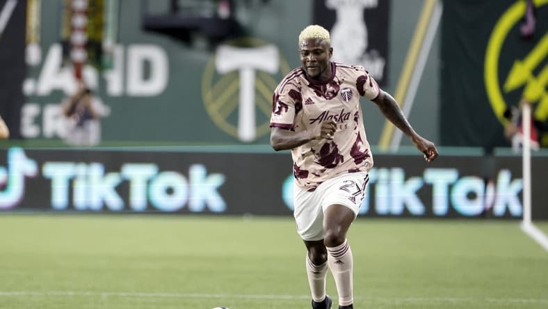 Jun 29, 2022; Portland, Oregon, USA; Portland Timbers forward Dairon Asprilla (27) carries the ball during the second half against the Houston Dynamo at Providence Park. Mandatory Credit: Soobum Im-USA TODAY Sports