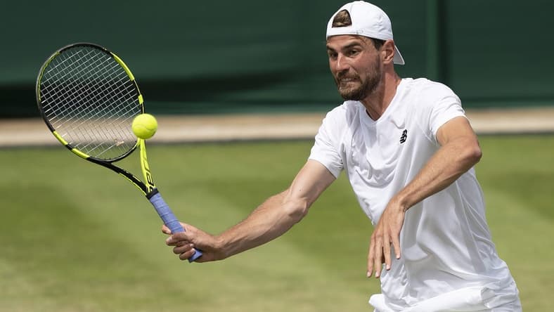 Jul 1, 2022; London, United Kingdom; Maxime Cressy (USA) returns a shot during his match against Jack Sock (USA) on day five at All England Lawn Tennis and Croquet Club. Mandatory Credit: Susan Mullane-USA TODAY Sports