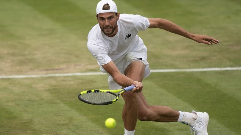 Jul 1, 2022; London, United Kingdom; Maxime Cressy (USA) returns a shot during his match against Jack Sock (USA) on day five at All England Lawn Tennis and Croquet Club. Mandatory Credit: Susan Mullane-USA TODAY Sports
