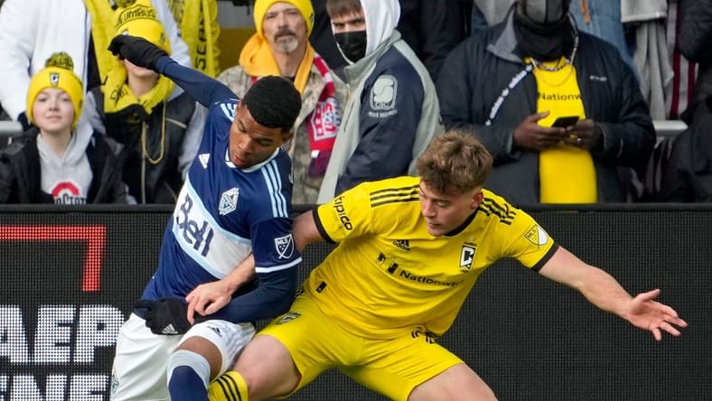 Vancouver Whitecaps midfielder Pedro Vite (45) and Columbus Crew midfielder Aidan Morris (21) compete for a ball during the second half of Saturday's season opener at Lower.com field in Columbus, Oh., on February 26, 2022.
Ceb Crew 0227 Bjp 37
