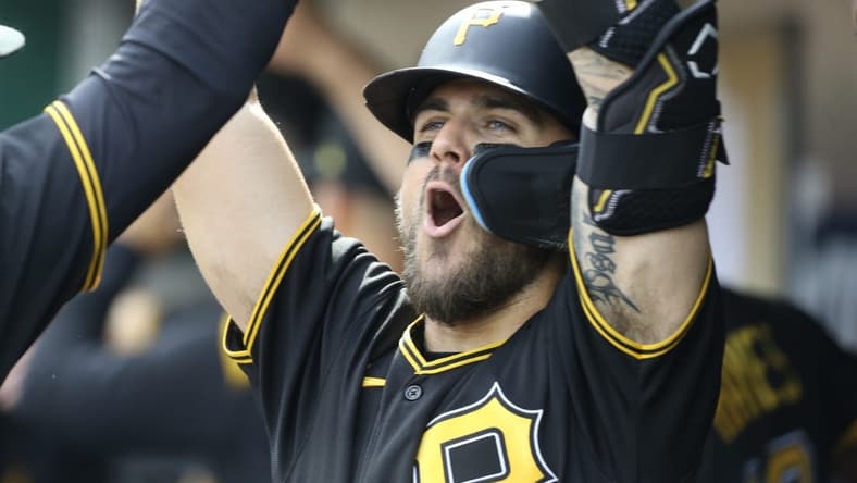 Jul 2, 2022; Pittsburgh, Pennsylvania, USA; Pittsburgh Pirates first baseman Michael Chavis (2) celebrates his two-run home run in the dugout against the Milwaukee Brewers during the third inning at PNC Park. Mandatory Credit: Charles LeClaire-USA TODAY Sports