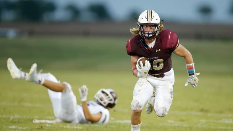 Cashion's Brexten Green carries the ball during a game against Perry on Sept. 4, 2020.