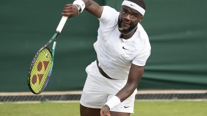 Jul 3, 2022; London, United Kingdom; Frances Tiafoe (USA) serves the ball during his match against David Goffin (BEL) on day seven at All England Lawn Tennis and Croquet Club. Mandatory Credit: Susan Mullane-USA TODAY Sports