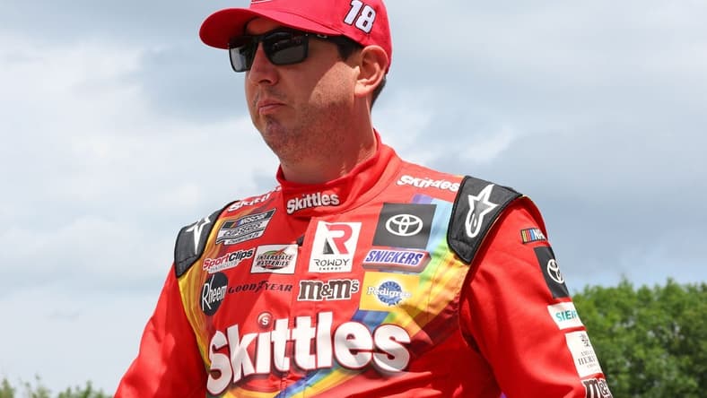 Jul 3, 2022; Elkhart Lake, Wisconsin, USA; NASCAR Cup Series driver Kyle Busch (18) before the start of the KWIK TRIP 250 at Road America. Mandatory Credit: Mike Dinovo-USA TODAY Sports