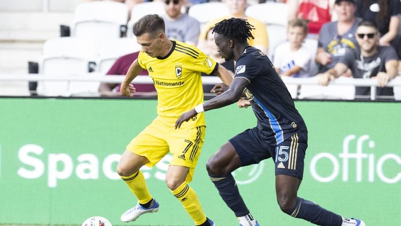Jul 3, 2022; Columbus, Ohio, USA; Columbus Crew forward Pedro Santos (7) advances past Philadelphia Union defender Olivier Mbaizo (15) in the first half at Lower.com Field. Mandatory Credit: Greg Bartram-USA TODAY Sports