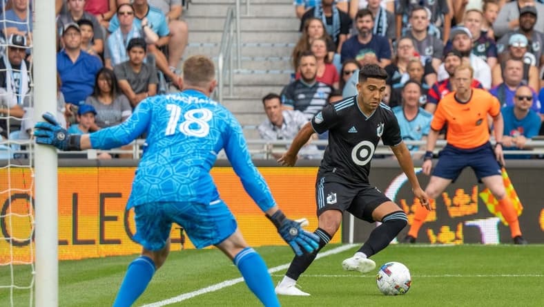 Jul 3, 2022; Saint Paul, Minnesota, USA; Minnesota United midfielder Emanuel Reynoso (10) faces Real Salt Lake goalkeeper Zac MacMath (18) in the first half at Allianz Field. Mandatory Credit: Matt Blewett-USA TODAY Sports