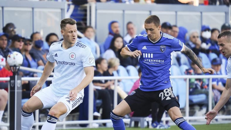 Jul 3, 2022; San Jose, California, USA; San Jose Earthquakes forward Benji Kikanovic (28) controls the ball against Chicago Fire midfielder Fabiran Herbers (21) during the first half at PayPal Park. Mandatory Credit: Kelley L Cox-USA TODAY Sports