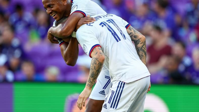 Jul 4, 2022; Orlando, Florida, USA; D.C. United forward Taxiarchis Fountas (11) is congratulated by forward Michael Estrada (7) after scoring his second goal against Orlando City in the first half at Exploria Stadium. Mandatory Credit: Nathan Ray Seebeck-USA TODAY Sports
