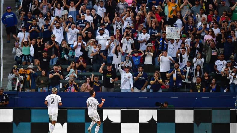 Jul 4, 2022; Carson, California, USA; Los Angeles Galaxy forward Javier Hernandez (14) celebrates his goal scored against CF Montreal with defender Julian Araujo (2) during the first half at Dignity Health Sports Park. Mandatory Credit: Gary A. Vasquez-USA TODAY Sports