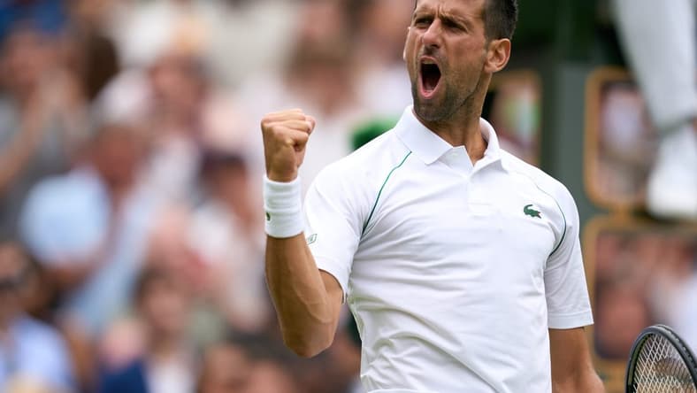 Jul 5, 2022; London, England, United Kingdom; Novak Djokovic (SRB) celebrates after match point against Jannik Sinner (ITA) during a quarterfinals mens singles match on Centre court at the 2022 Wimbledon Championships at All England Lawn Tennis and Croquet Club. Mandatory Credit: Peter van den Berg-USA TODAY Sports