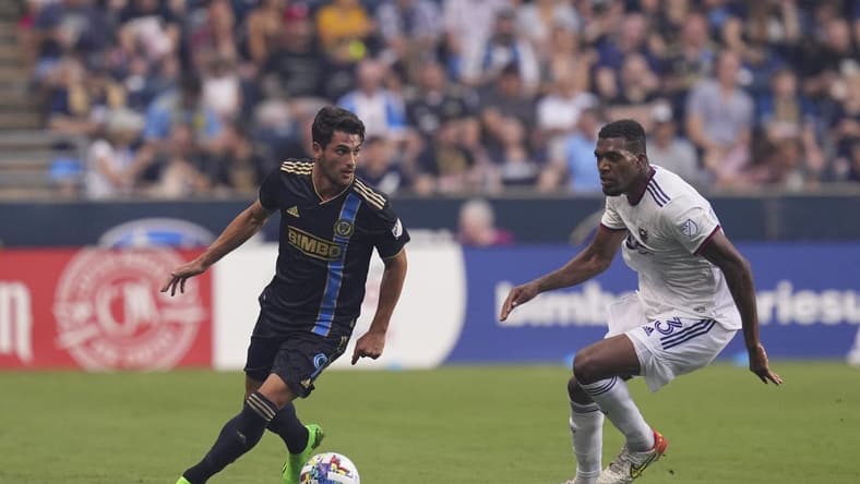 Jul 8, 2022; Chester, Pennsylvania, USA; Philadelphia Union forward Julian Carranza (9) controls the ball against D.C. United defender Donovan Pines (23) in the first half at Subaru Park. Mandatory Credit: Mitchell Leff-USA TODAY Sports