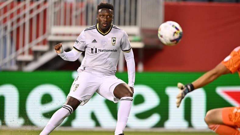 Jul 9, 2022; Chicago, Illinois, USA;  Columbus Crew SC midfielder Derrick Etienne (22) scores a goal in the second half against the Chicago Fire FC at Soldier Field. Mandatory Credit: Jamie Sabau-USA TODAY Sports