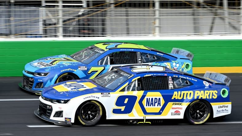 Jul 10, 2022; Hampton, Georgia, USA; NASCAR Cup Series driver Chase Elliott (9) and NASCAR Cup Series driver Corey LaJoie (7) race during the Quaker State 400 at Atlanta Motor Speedway. Mandatory Credit: Adam Hagy-USA TODAY Sports