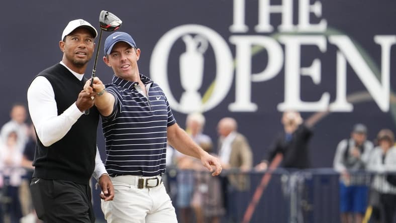 Jul 11, 2022; St. Andrews, SCT; Tiger Woods and Rory McIlroy during the R&A Celebration of Champions four-hole challenge at the 150th Open Championship golf tournament at St. Andrews Old Course. Mandatory Credit: Rob Schumacher-USA TODAY Sports