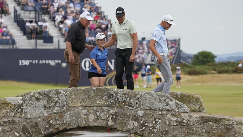 Jul 11, 2022; St. Andrews, Fife, SCT; Mark O'meara (left) Jennifer Sraga (center left) Henrik Stenson and Aaron Jarvis on the Swilcan Bridge on the 18th fairway during the Celebration of Champions at the 150th Open Championship golf tournament at St. Andrews Old Course. Mandatory Credit: Michael Madrid-USA TODAY Sports