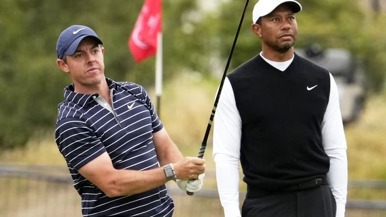 Jul 11, 2022; St. Andrews, SCT; Rory McIlroy and Tiger Woods during the R&A Celebration of Champions four-hole challenge at the 150th Open Championship golf tournament at St. Andrews Old Course. Mandatory Credit: Rob Schumacher-USA TODAY Sports