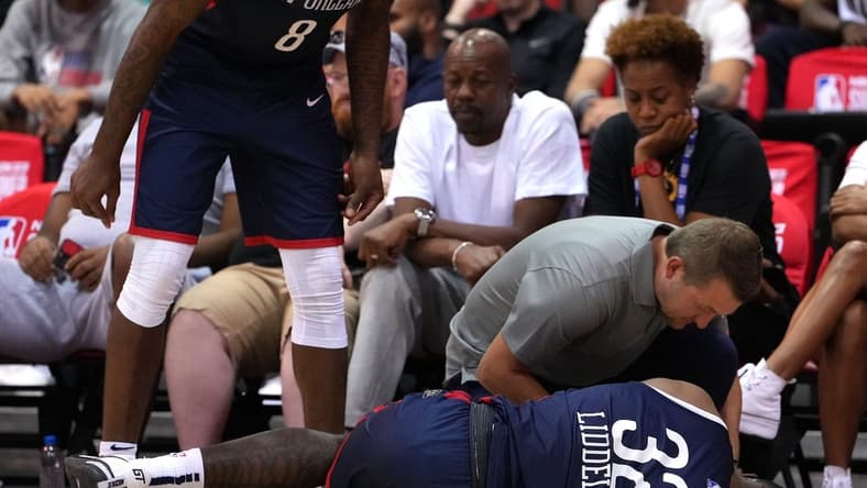Jul 11, 2022; Las Vegas, NV, USA; New Orleans Pelicans forward E.J. Liddell (32) suffers an apparent injury during an NBA Summer League game against the Atlanta Hawks at Cox Pavilion. Mandatory Credit: Stephen R. Sylvanie-USA TODAY Sports