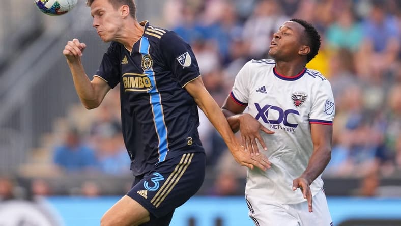 Jul 8, 2022; Chester, Pennsylvania, USA; Philadelphia Union defender Jack Elliott (3) plays the ball off his head against D.C. United forward Michael Estrada (7) at Subaru Park. Mandatory Credit: Mitchell Leff-USA TODAY Sports