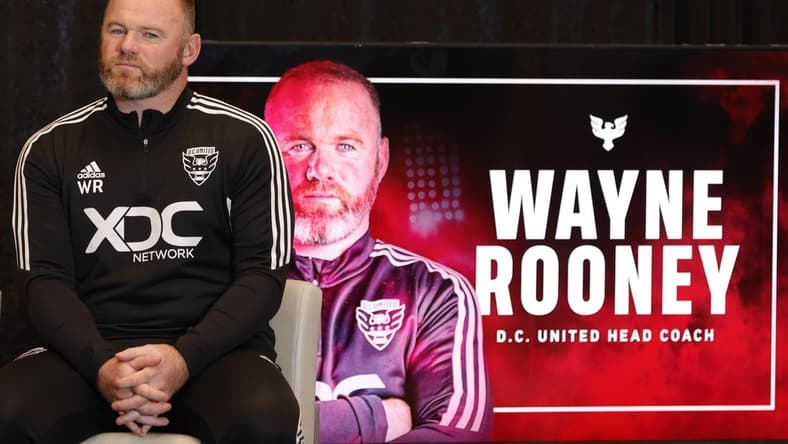Jul 12, 2022; Washington, DC, USA; D.C. United new head coach Wayne Rooney listens at an introductory press conference at Audi Field. Mandatory Credit: Geoff Burke-USA TODAY Sports