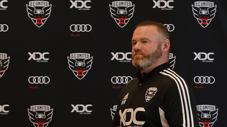 Jul 12, 2022; Washington, DC, USA; D.C. United new head coach Wayne Rooney walks to the stage for an introductory press conference at Audi Field. Mandatory Credit: Geoff Burke-USA TODAY Sports