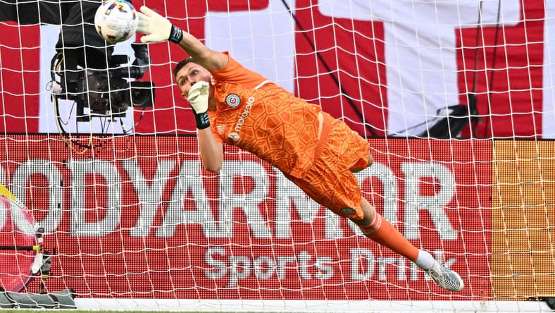 Jul 13, 2022; Chicago, Illinois, USA; Chicago Fire FC goalkeeper Gaga Slonina (1) redirects a Toronto FC shot away from the net with his fingertips in the first half at Soldier Field. Mandatory Credit: Jamie Sabau-USA TODAY Sports