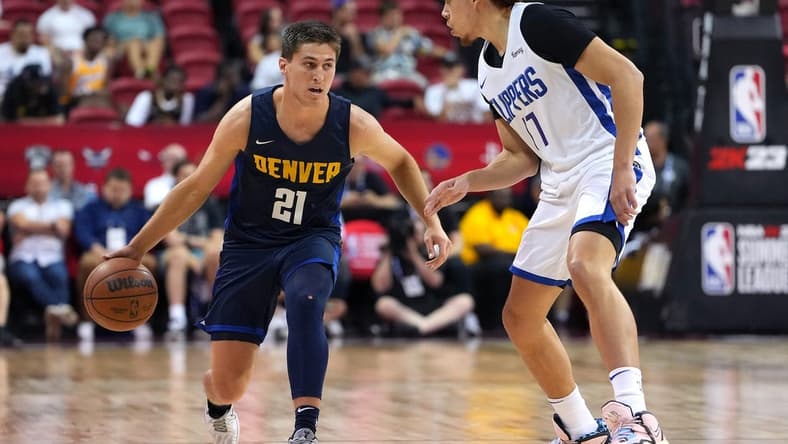 Jul 13, 2022; Las Vegas, NV, USA; Denver Nuggets guard Collin Gillespie (21) dribbles against LA Clippers guard Jason Preston (17) during an NBA Summer League game at Thomas & Mack Center. Mandatory Credit: Stephen R. Sylvanie-USA TODAY Sports