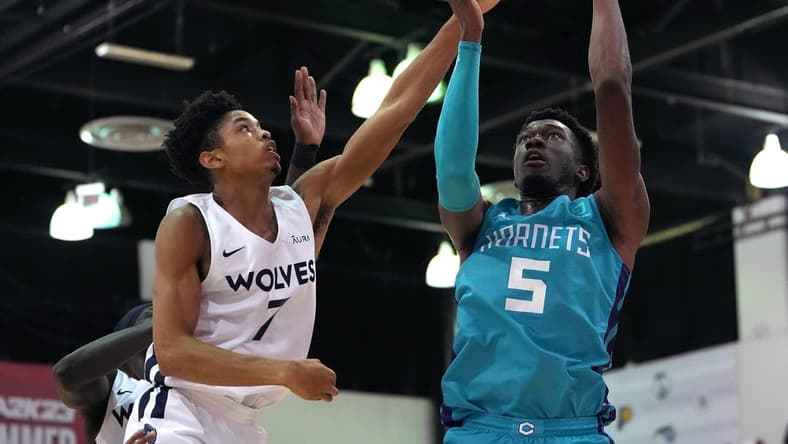 Jul 16, 2022; Las Vegas, NV, USA; Charlotte Hornets center Mark Williams (5) shoots against Minnesota Timberwolves forward Josh Minott (7) during an NBA Summer League game at Cox Pavillion. Mandatory Credit: Stephen R. Sylvanie-USA TODAY Sports