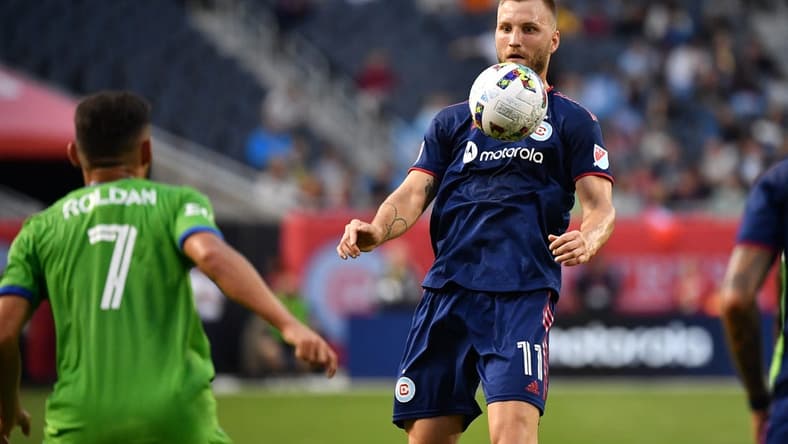 Jul 16, 2022; Chicago, Illinois, USA; Chicago Fire FC forward Kacper Przybylko (11) settles a throw against the Seattle Sounders in in the first half at Soldier Field. Mandatory Credit: Jamie Sabau-USA TODAY Sports