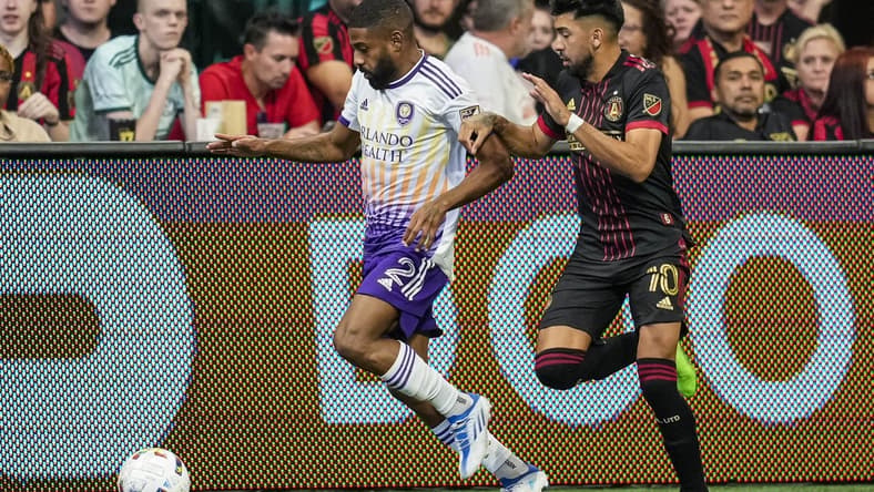 Jul 17, 2022; Atlanta, Georgia, USA; Orlando City defender Ruan (2) tries for the ball defended by Atlanta United midfielder Marcelino Moreno (10) during the first half at Mercedes-Benz Stadium. Mandatory Credit: Dale Zanine-USA TODAY Sports