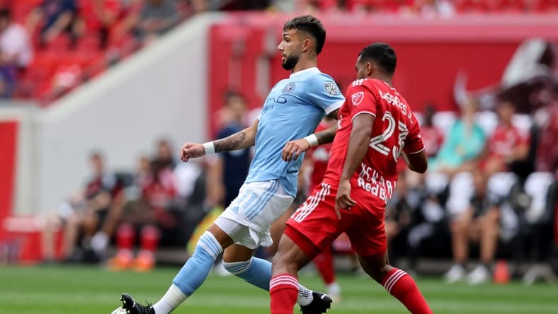 Jul 17, 2022; Harrison, New Jersey, USA; New York City midfielder Valentin Castellanos (11) controls the ball against New York Red Bulls midfielder Cristian Casseres Jr (23) during the first half at Red Bull Arena. Mandatory Credit: Brad Penner-USA TODAY Sports