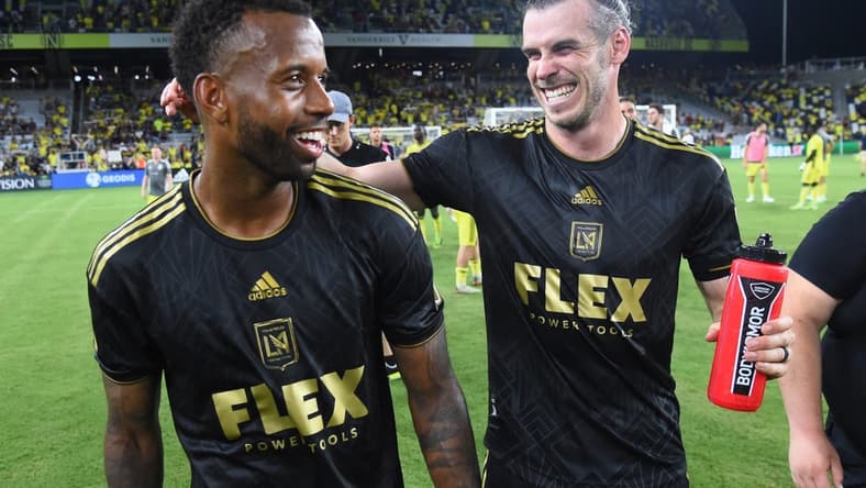 Jul 17, 2022; Nashville, Tennessee, USA; Los Angeles FC forward Gareth Bale (11) celebrates with midfielder Kellyn Acosta (23) after a win against the Nashville SC at Geodis Park. Mandatory Credit: Christopher Hanewinckel-USA TODAY Sports