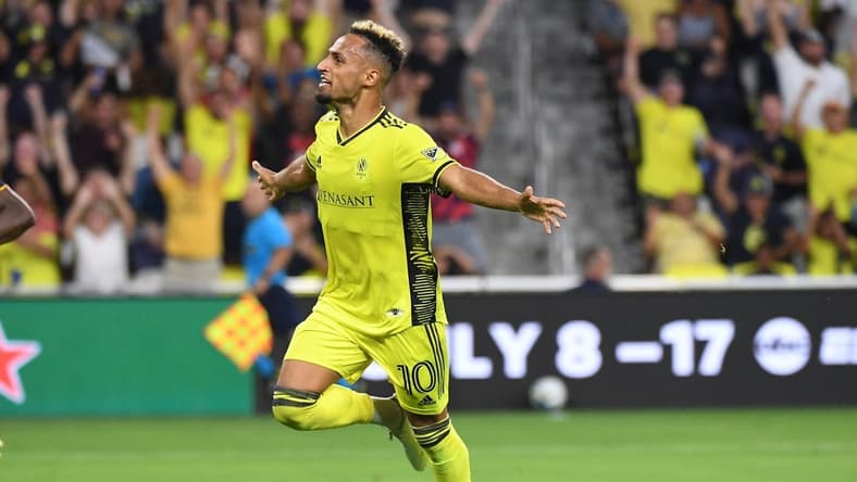 Jul 13, 2022; Nashville, Tennessee, USA; Nashville SC midfielder Hany Mukhtar (10) celebrates after a goal during the first half against the Seattle Sounders at GEODIS Park. Mandatory Credit: Christopher Hanewinckel-USA TODAY Sports