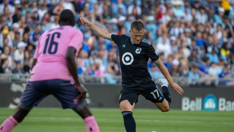 Jul 20, 2022; Minneapolis, MN, USA; Minnesota United midfielder Robin Lod (17) shoots as Everton midfielder Abdoulaye Doucoure (16) defends in the first half at Allianz Field. Mandatory Credit: Matt Blewett-USA TODAY Sports