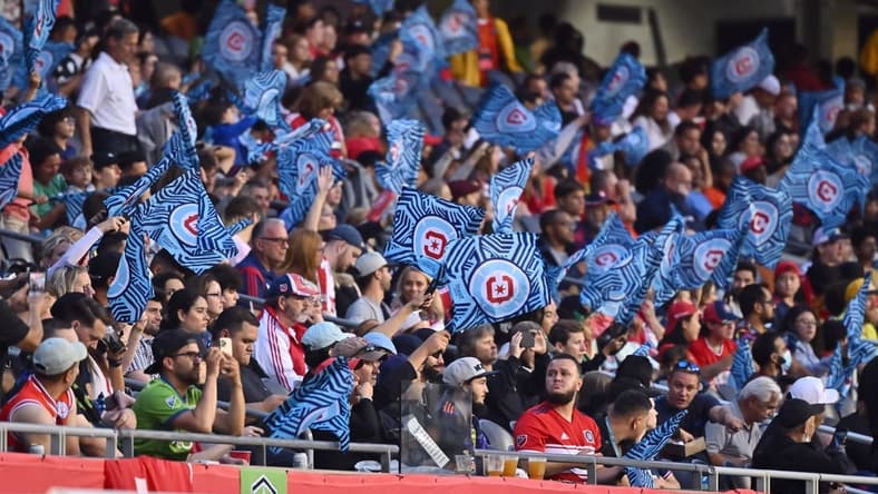 Jul 16, 2022; Chicago, Illinois, USA; Chicago Fire FC fans wave their flags during a match against the Seattle Sounders at Soldier Field. Chicago defeated Seattle 1-0. Mandatory Credit: Jamie Sabau-USA TODAY Sports