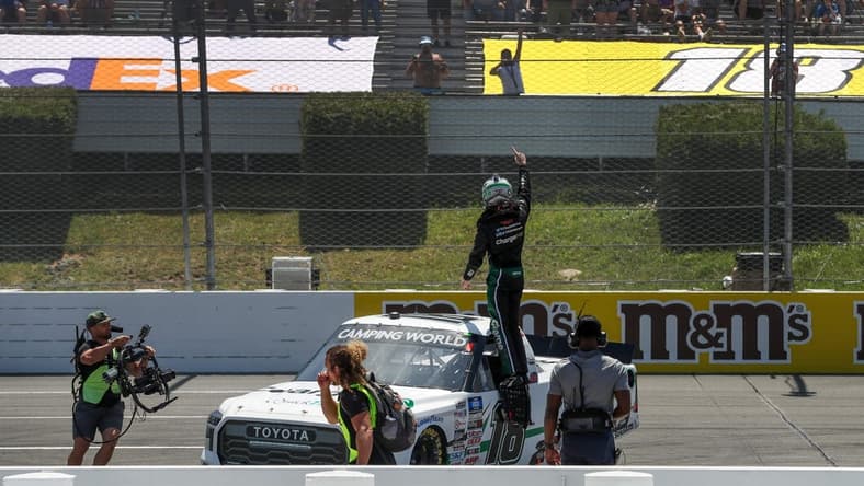 Jul 23, 2022; Long Pond, Pennsylvania, USA; NASCAR Camping World Truck Series driver Chandler Smith celebrates after winning the CRC Brakleen 150 at Pocono Raceway. Mandatory Credit: Matthew OHaren-USA TODAY Sports