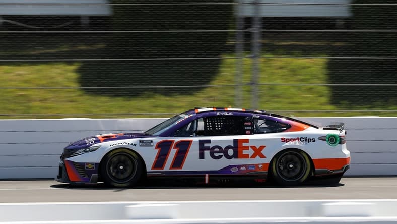Jul 23, 2022; Long Pond, Pennsylvania, USA; NASCAR Cup Series driver Denny Hamlin (11) during practice and qualifying for the M&Ms Fan Appreciation 400 at Pocono Raceway. Mandatory Credit: Matthew OHaren-USA TODAY Sports