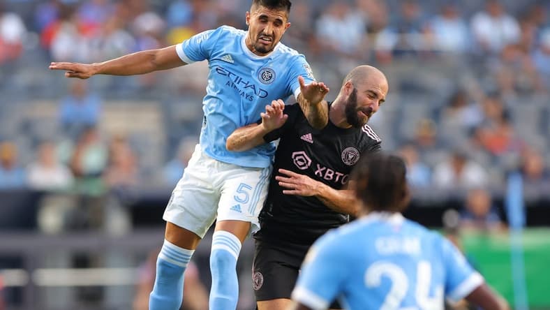 Jul 23, 2022; New York, New York, USA; New York City FC defender Thiago Martins (5) battles for the ball against Inter Miami CF forward Gonzalo Higuain (10) during the first half at Yankee Stadium. Mandatory Credit: Vincent Carchietta-USA TODAY Sports