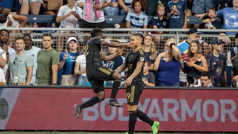 Jul 23, 2022; Kansas City, Kansas, USA; Los Angeles FC forward Cristian Arango (9) celebrates with defender Franco Escobar (2) after a goal against the Sporting Kansas City during the second half at Children's Mercy Park. Mandatory Credit: William Purnell-USA TODAY Sports