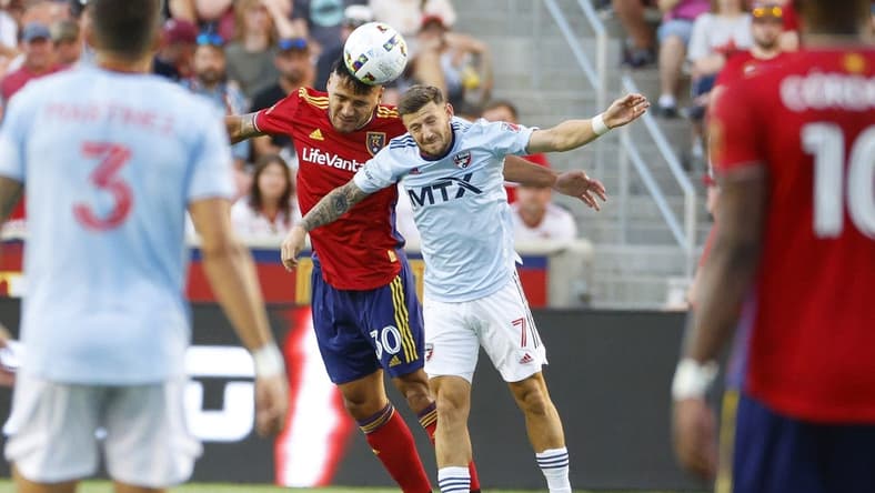 Jul 23, 2022; Sandy, Utah, USA; Real Salt Lake defender Marcelo Silva (30) and FC Dallas forward Paul Arriola (7) battle in the first half at Rio Tinto Stadium. Mandatory Credit: Jeffrey Swinger-USA TODAY Sports