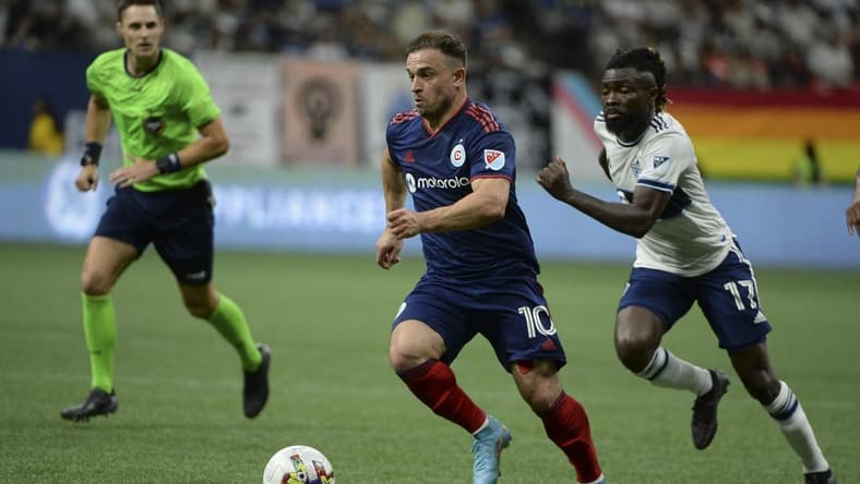 Jul 23, 2022; Vancouver, British Columbia, CAN; Chicago Fire FC midfielder Xherdan Shaqiri (10) dribbles the ball against Vancouver Whitecaps FC midfielder Leonard Owusu (17) during the second half at BC Place. Mandatory Credit: Anne-Marie Sorvin-USA TODAY Sports